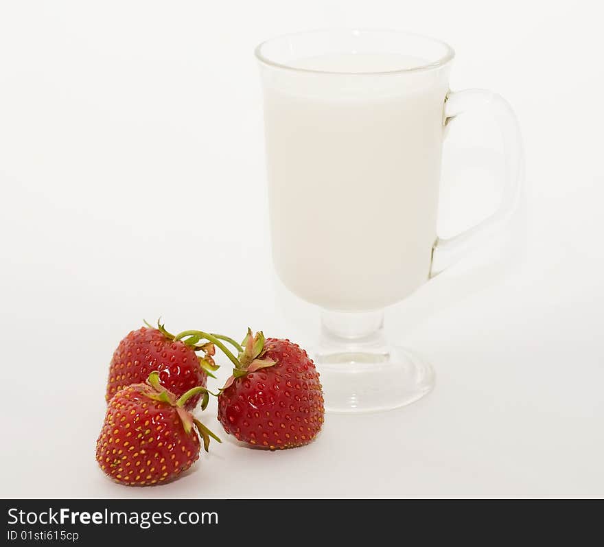 Glass cup milk berries of the strawberries. Glass cup milk berries of the strawberries