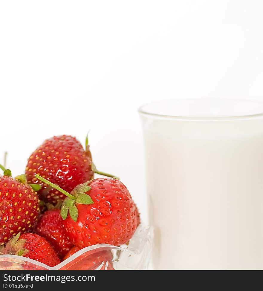 Glass cup with milk and berries