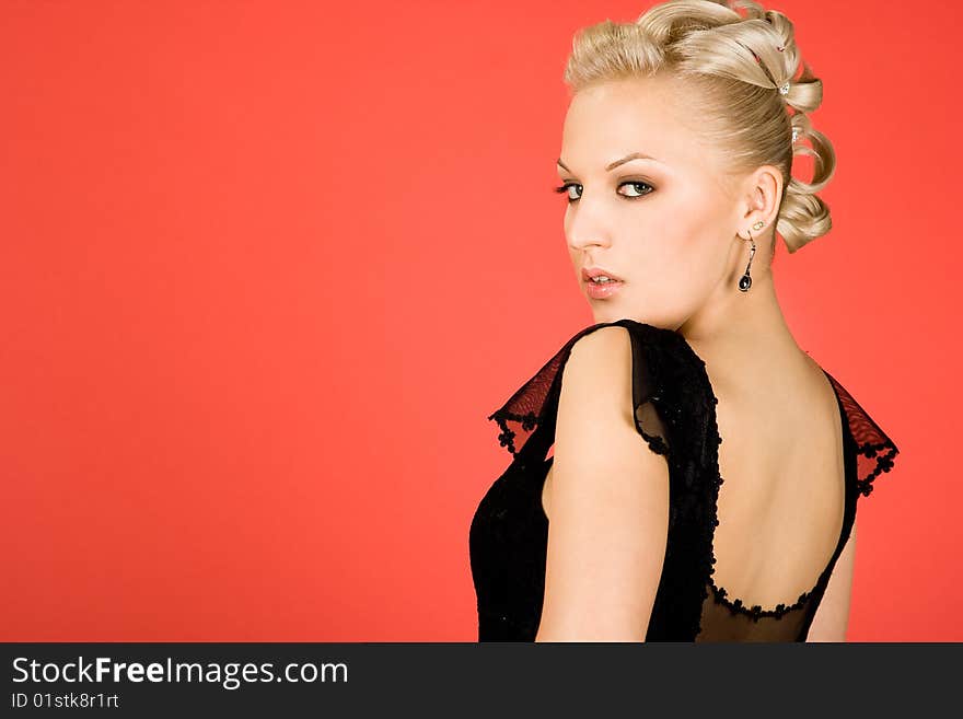 Elegant girl on red background