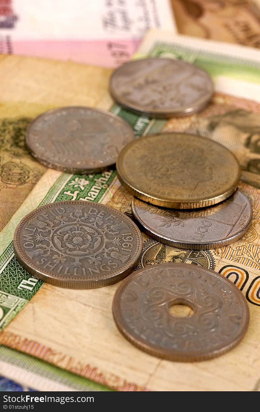 Foreign coins and notes with selective focus