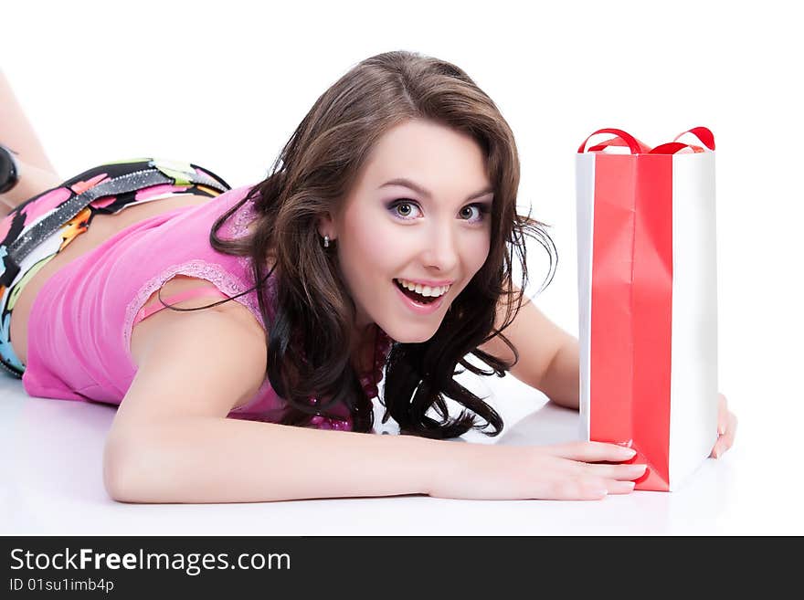 Young woman with shopping bag laughing. Young woman with shopping bag laughing