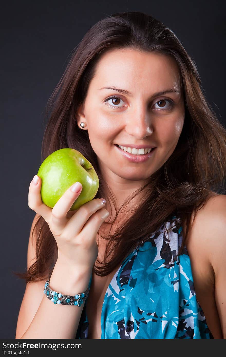 Beautiful girl with green apple