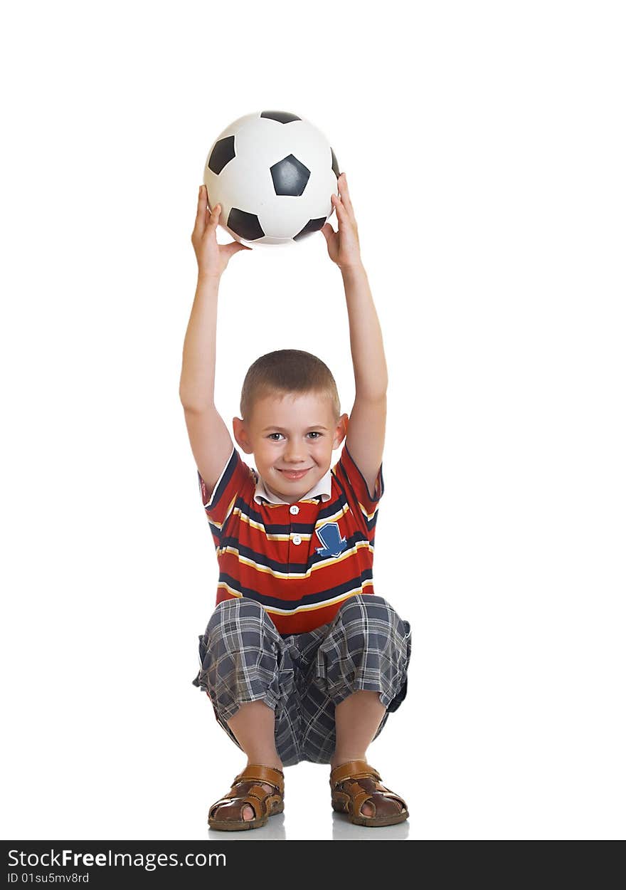 Young boy holding football in his hand. Young boy holding football in his hand