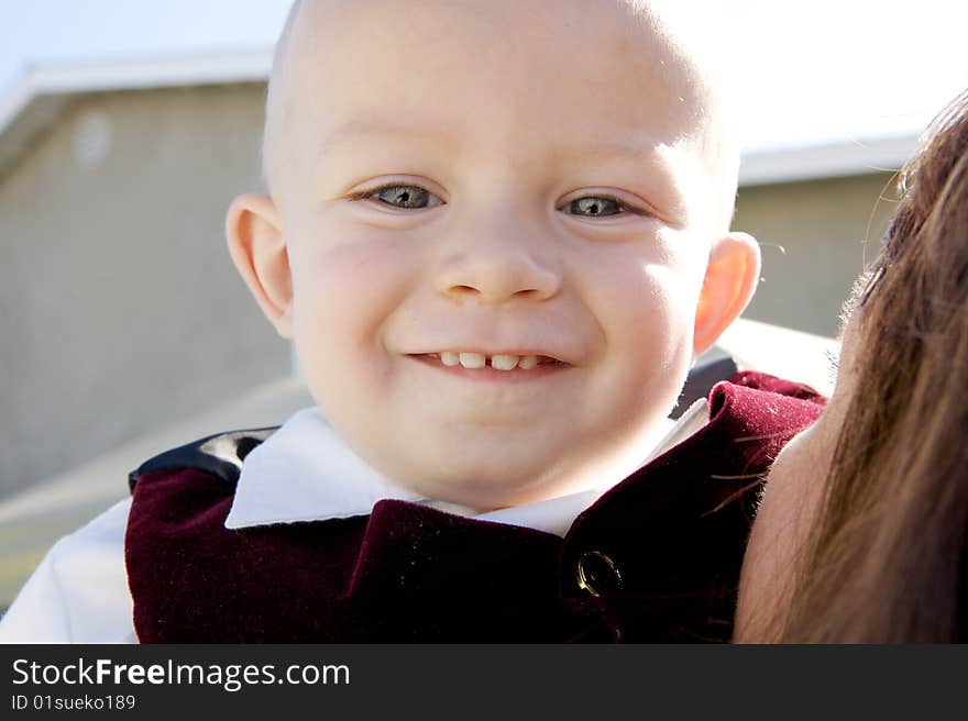 A Smiling Little Boy with big blue eyes