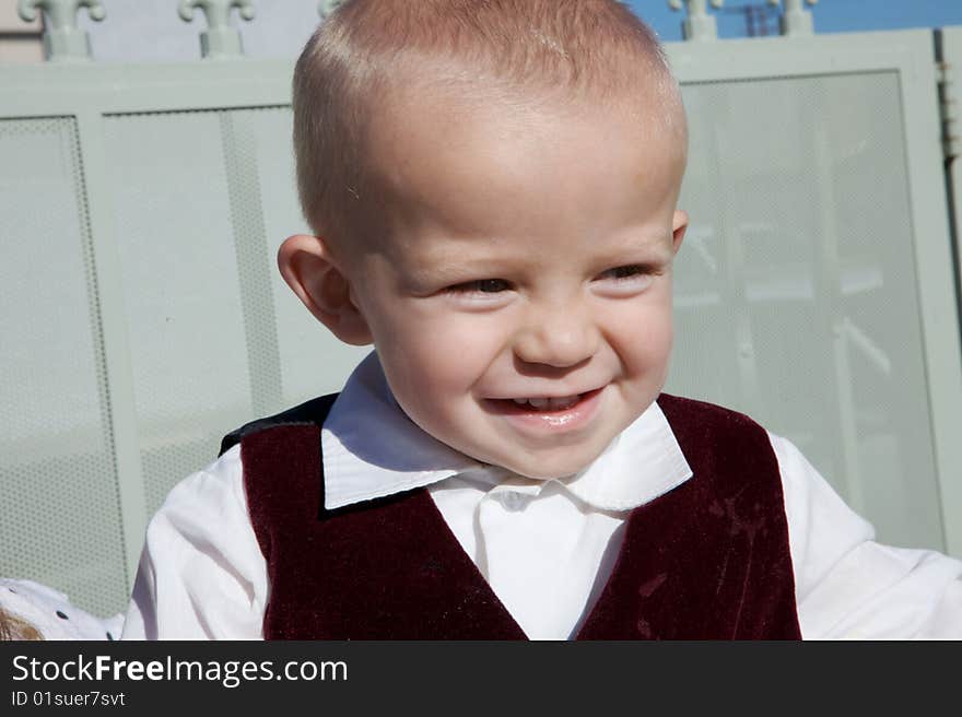 A Smiling Little Boy with big blue eyes