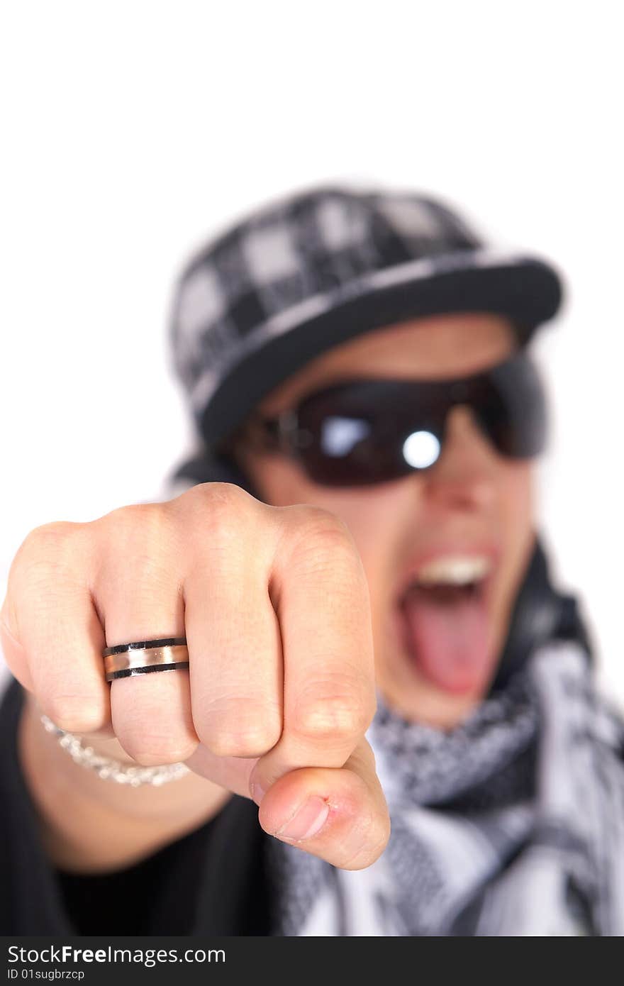 A young DJ is pointing at the camera and screaming. The focus is on his fist! Isolated over white. A young DJ is pointing at the camera and screaming. The focus is on his fist! Isolated over white.