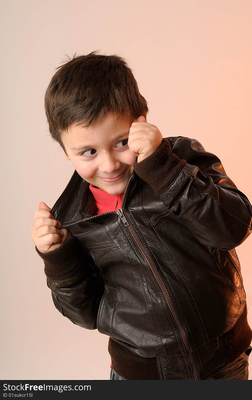 Elegant boy with brown jacket in studio. Elegant boy with brown jacket in studio