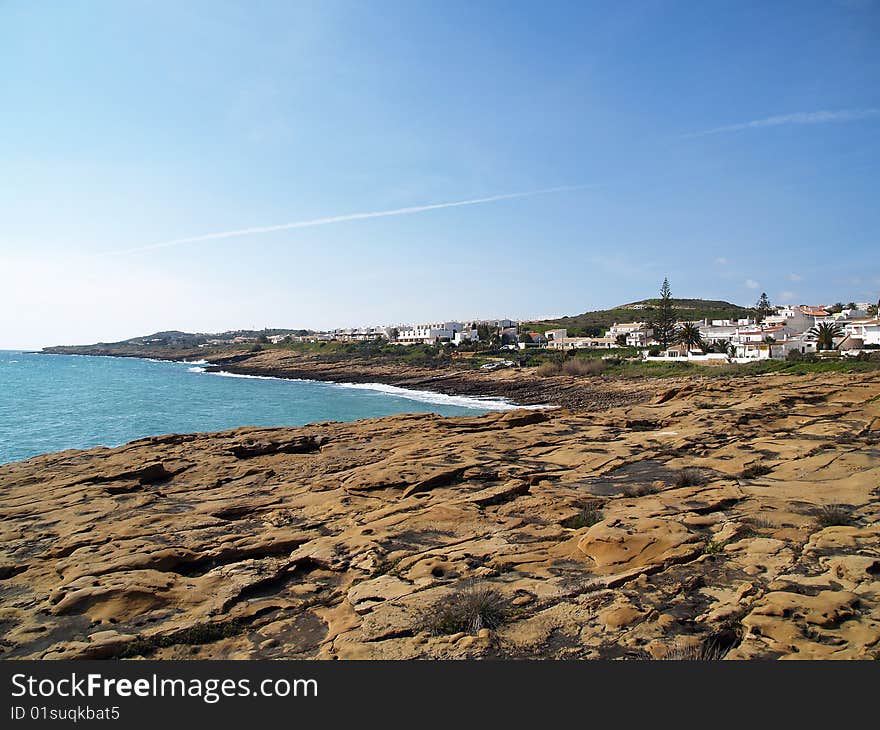 Small town of luz, in algarve, portugal. vire of the interesting beach rock formations. Small town of luz, in algarve, portugal. vire of the interesting beach rock formations