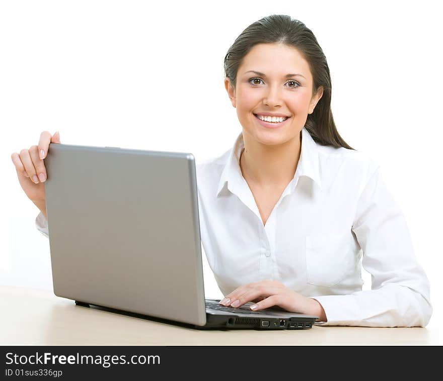 Portrait of beautiful businesswoman sitting at the table. Portrait of beautiful businesswoman sitting at the table