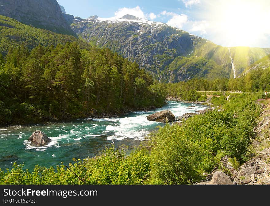 River and high mountains on bright sunny day. River and high mountains on bright sunny day