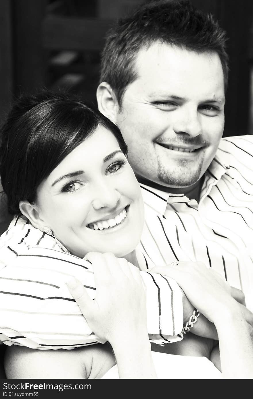 Beautiful brunette bride sitting by her groom. Beautiful brunette bride sitting by her groom