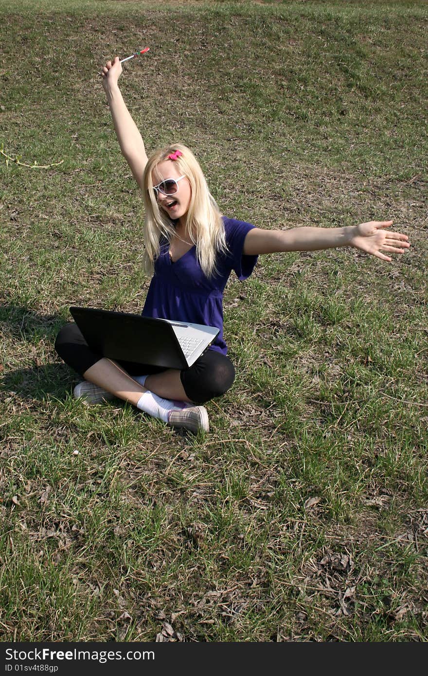 Happy girl with a laptop