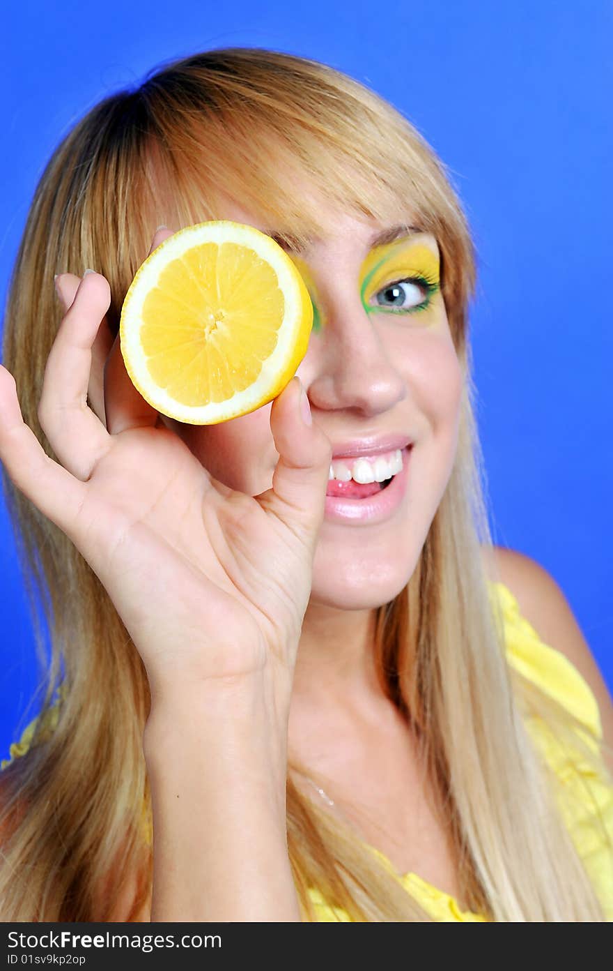 Blond girl with yellow lemon. Blond girl with yellow lemon