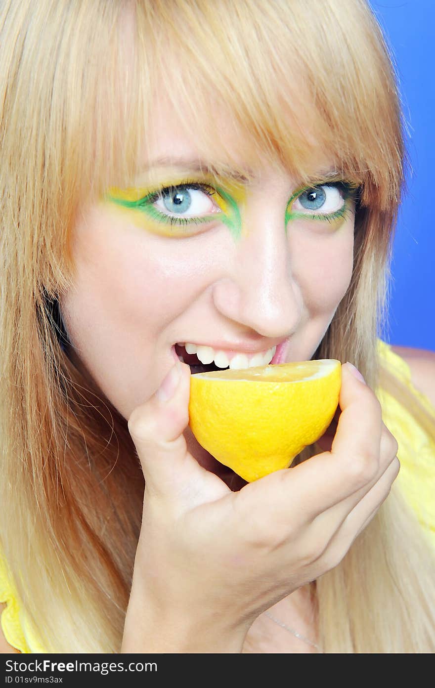 Blond girl with yellow lemon. Blond girl with yellow lemon