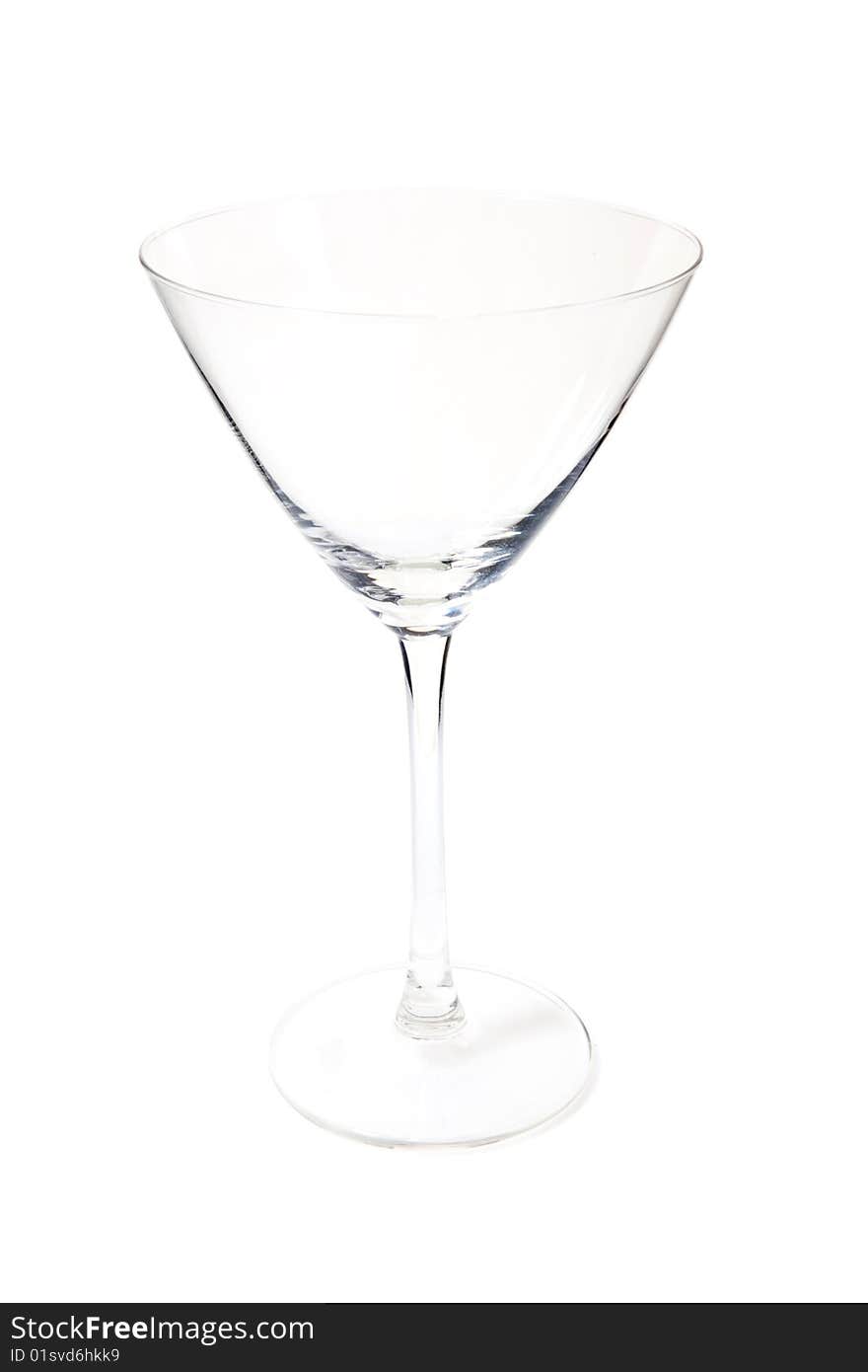 Empty cocktail glass on white ground