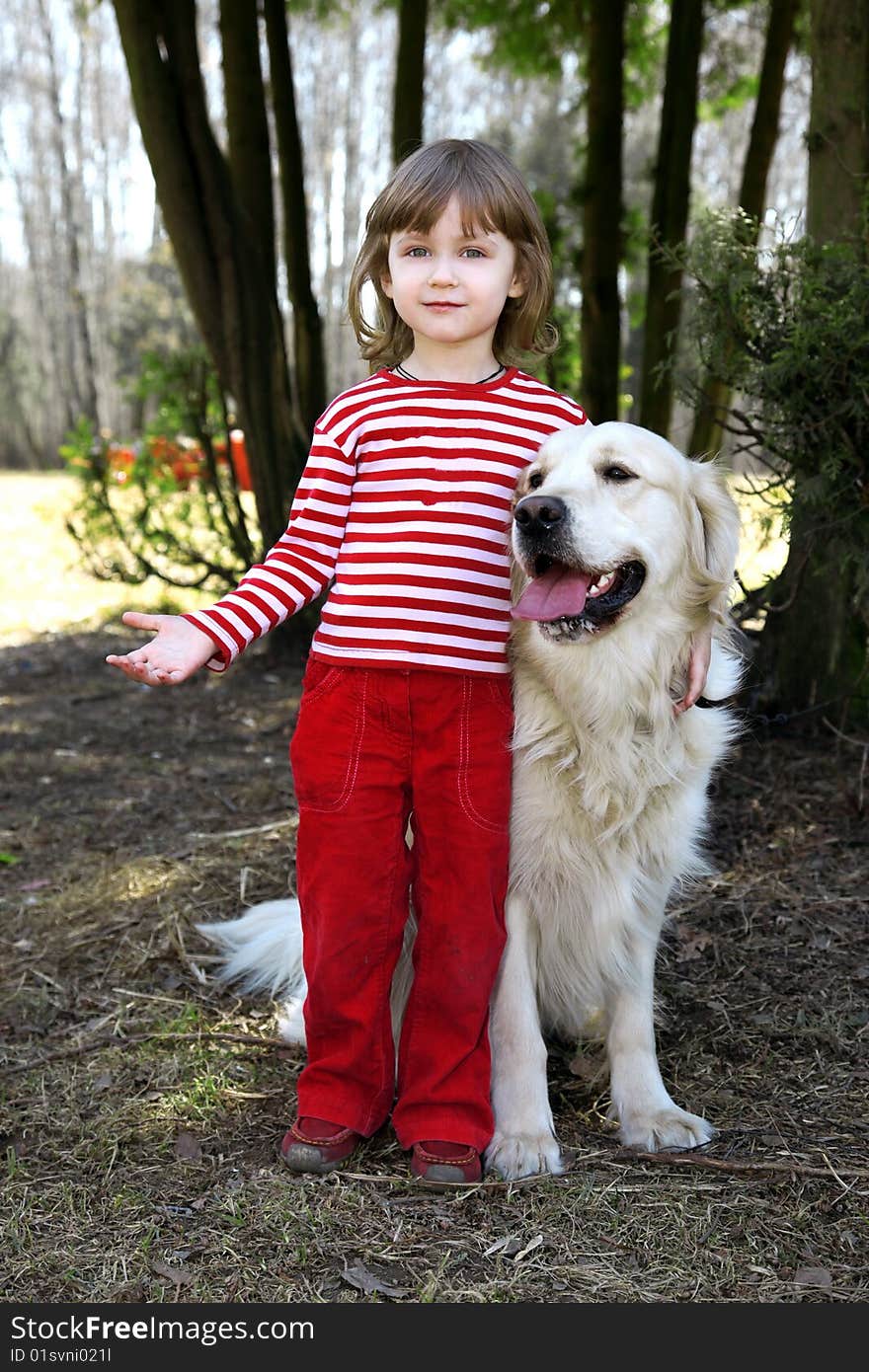 Friends - little girl with big retriever outdoor