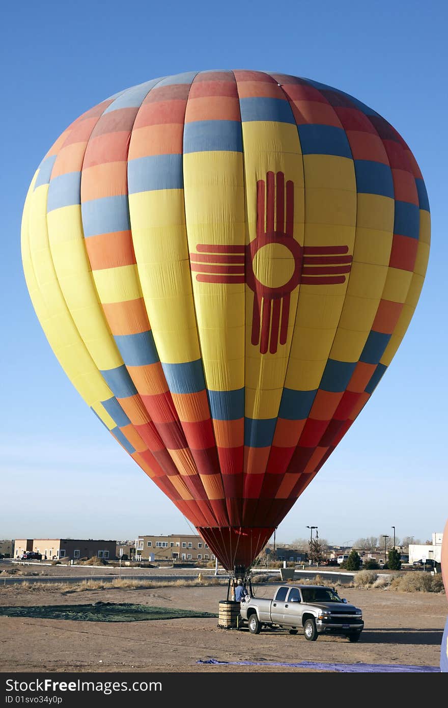 Hot air balloon on the ground with car