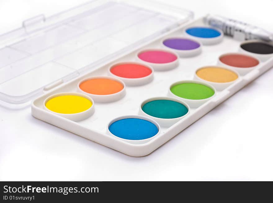 A box full of colorful gouache isolated on white