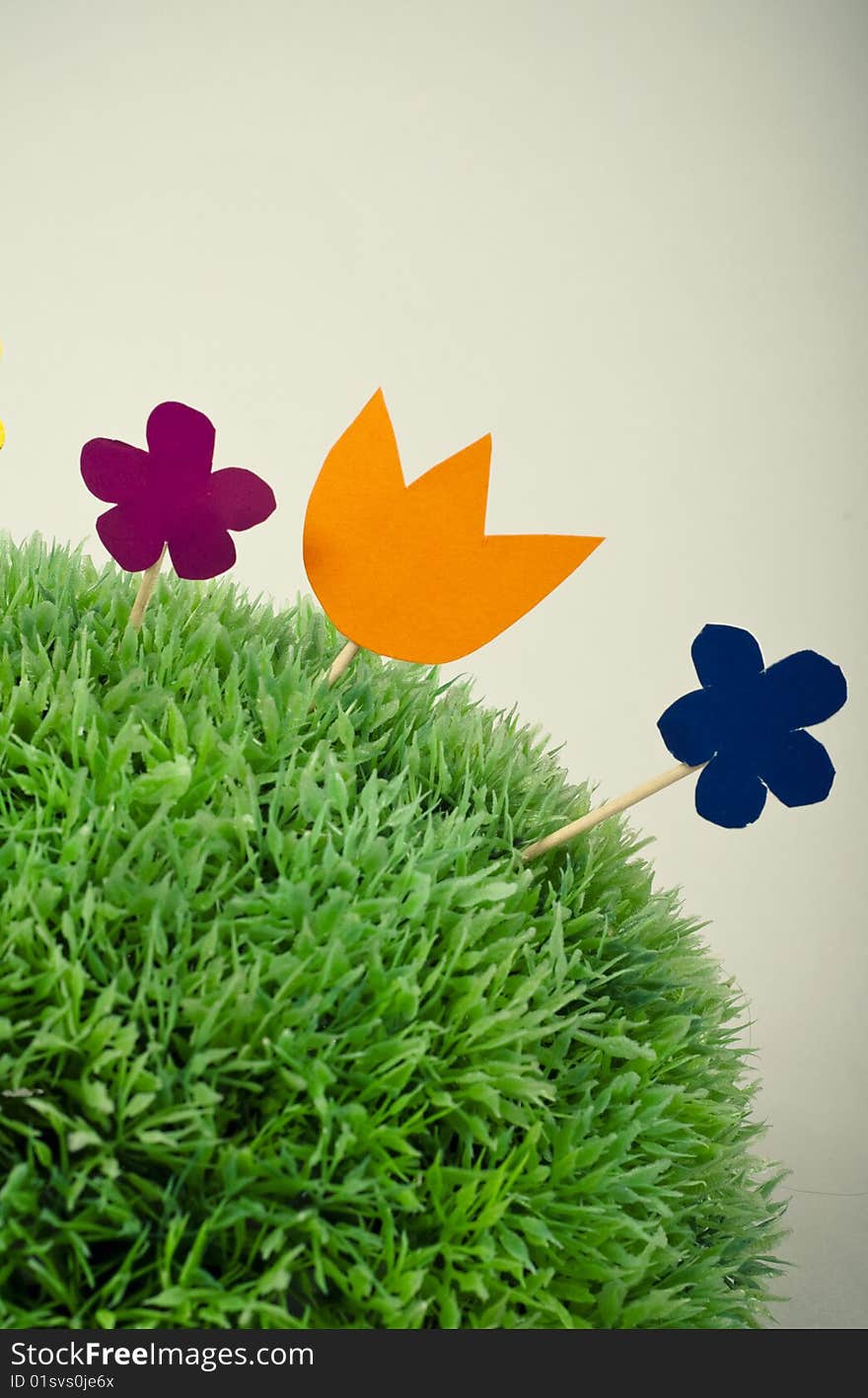 Paper  flowers on green grass. Paper  flowers on green grass