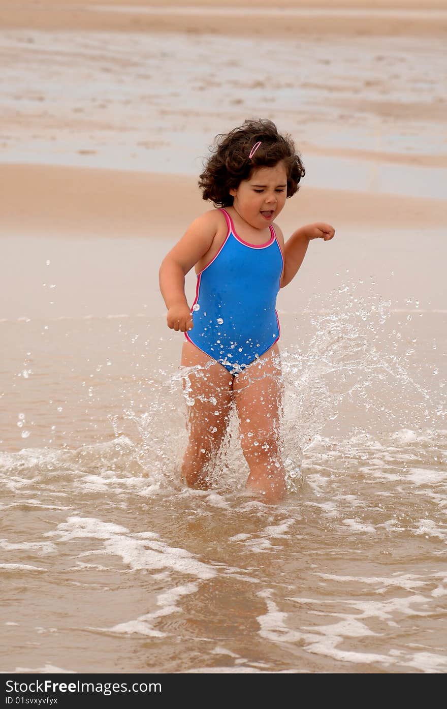 Cute Little Girl On The Beach