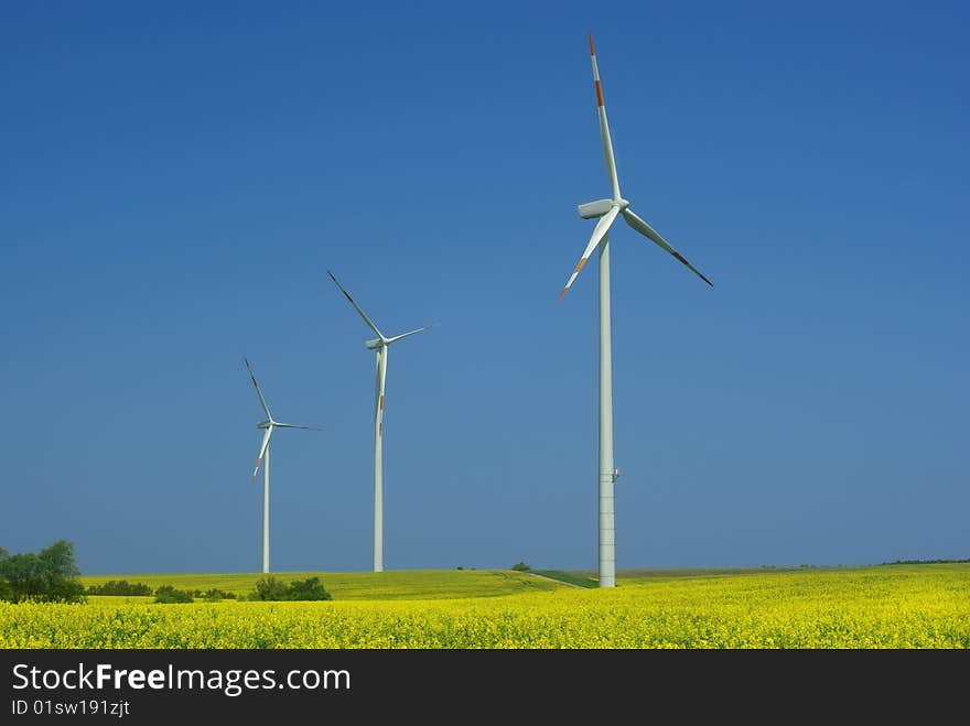 Wind turbine on blue sky background