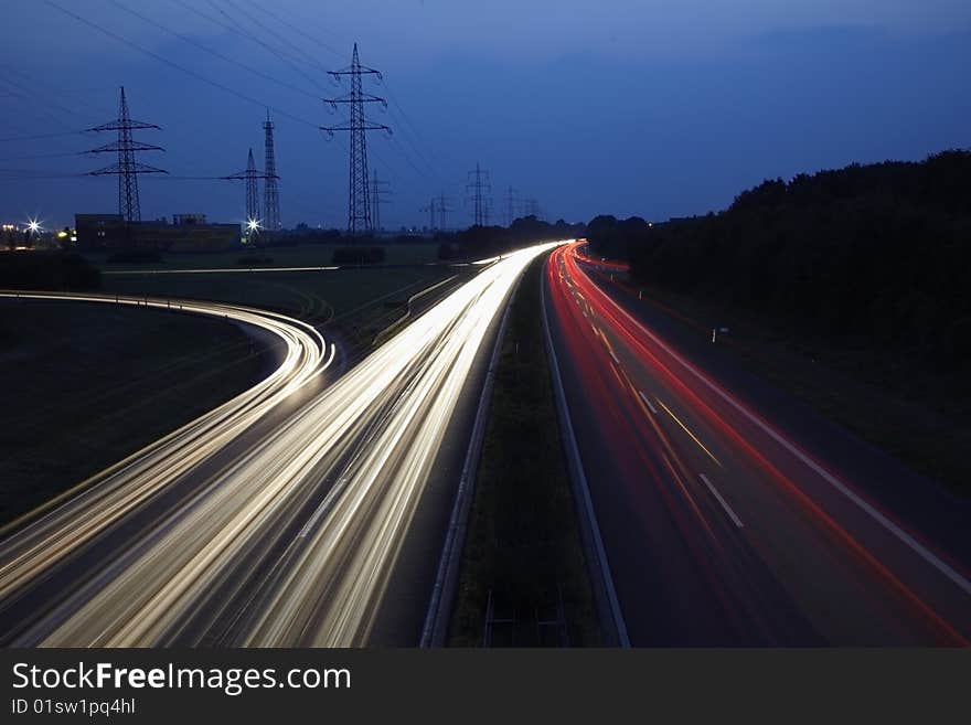 Motorway / Highway with traffic at nightfall. Motorway / Highway with traffic at nightfall.