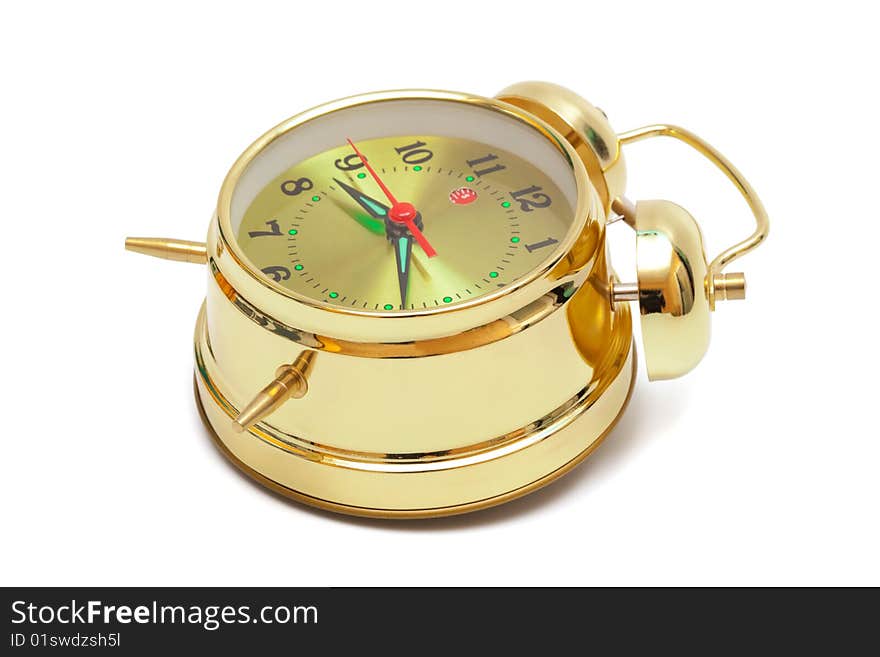 Beautiful gold alarm clock on white background