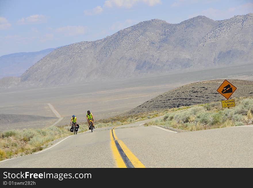 Couple of Cyclist on Desert Road