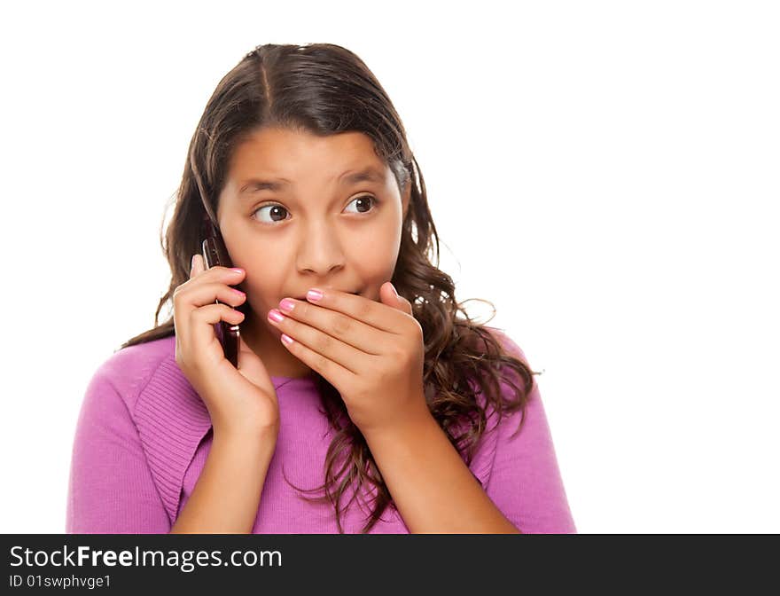 Shocked Pretty Hispanic Girl On Cell Phone Isolated on a White Background.