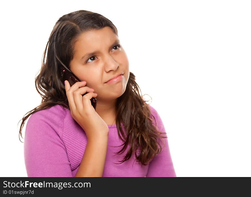 Frowning Hispanic Girl On Cell Phone Isolated on a White Background.