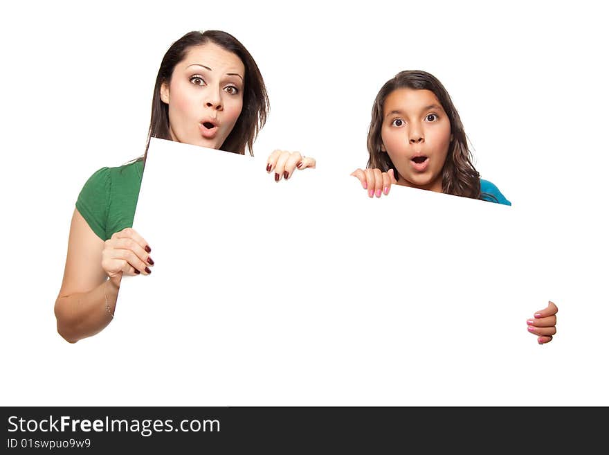 Pretty Hispanic Girl and Mother Holding Blank Board Isolated on a White Background.