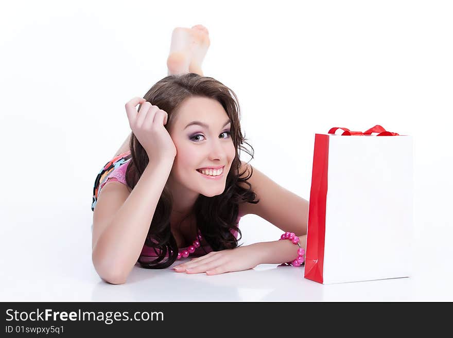 Young woman with shopping bag laughing. Young woman with shopping bag laughing