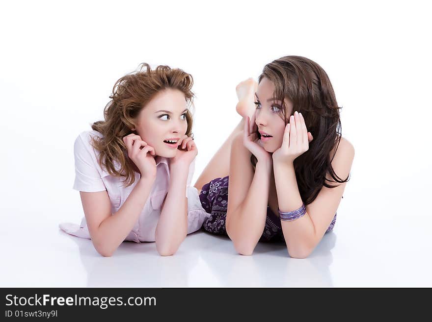 Young women speaking and looking at each other. Young women speaking and looking at each other