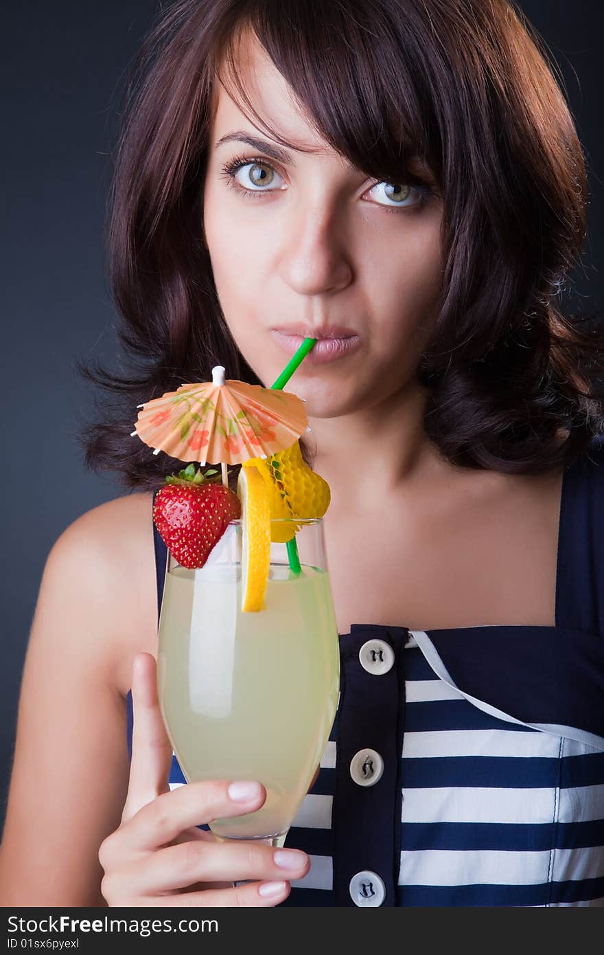 Beautiful girl with a fruit cocktail