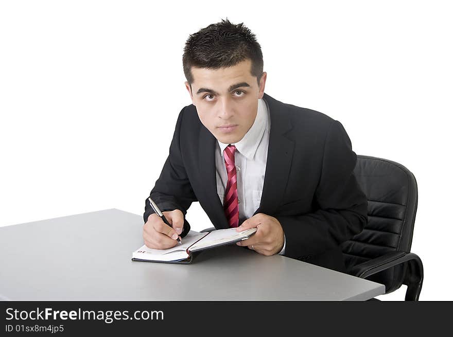 Young man in suit writing. Young man in suit writing