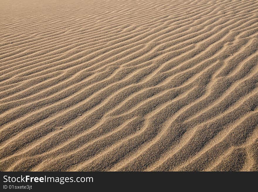 Wavy texture of desert sand dunes in Death Valley. Wavy texture of desert sand dunes in Death Valley