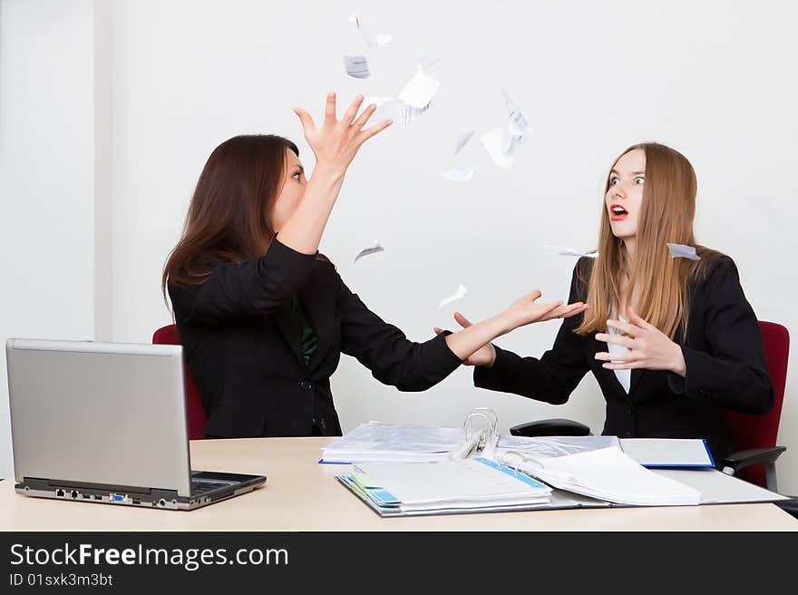 Business woman throws upwards the broken off document. Business woman throws upwards the broken off document