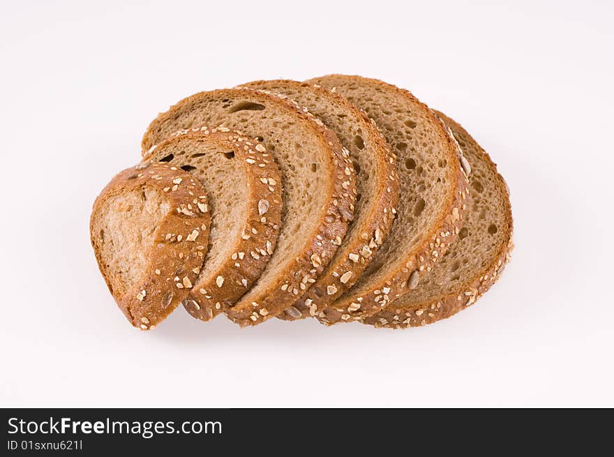 Slices of bread on white background