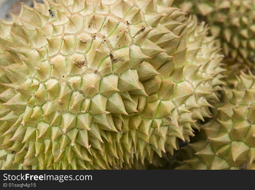 Fresh durian fruit at an outdoor market stall