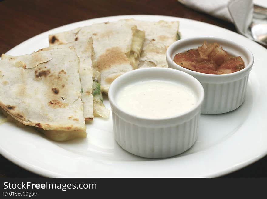 Cheese flavored pita bread with mayonnaise and tomato dressing