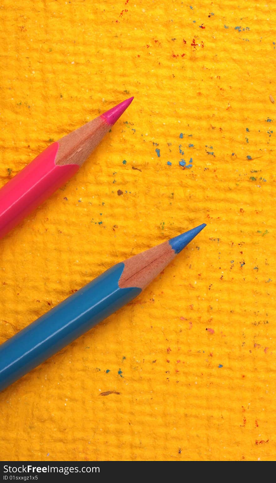 Multicolored pencils with handmade paper