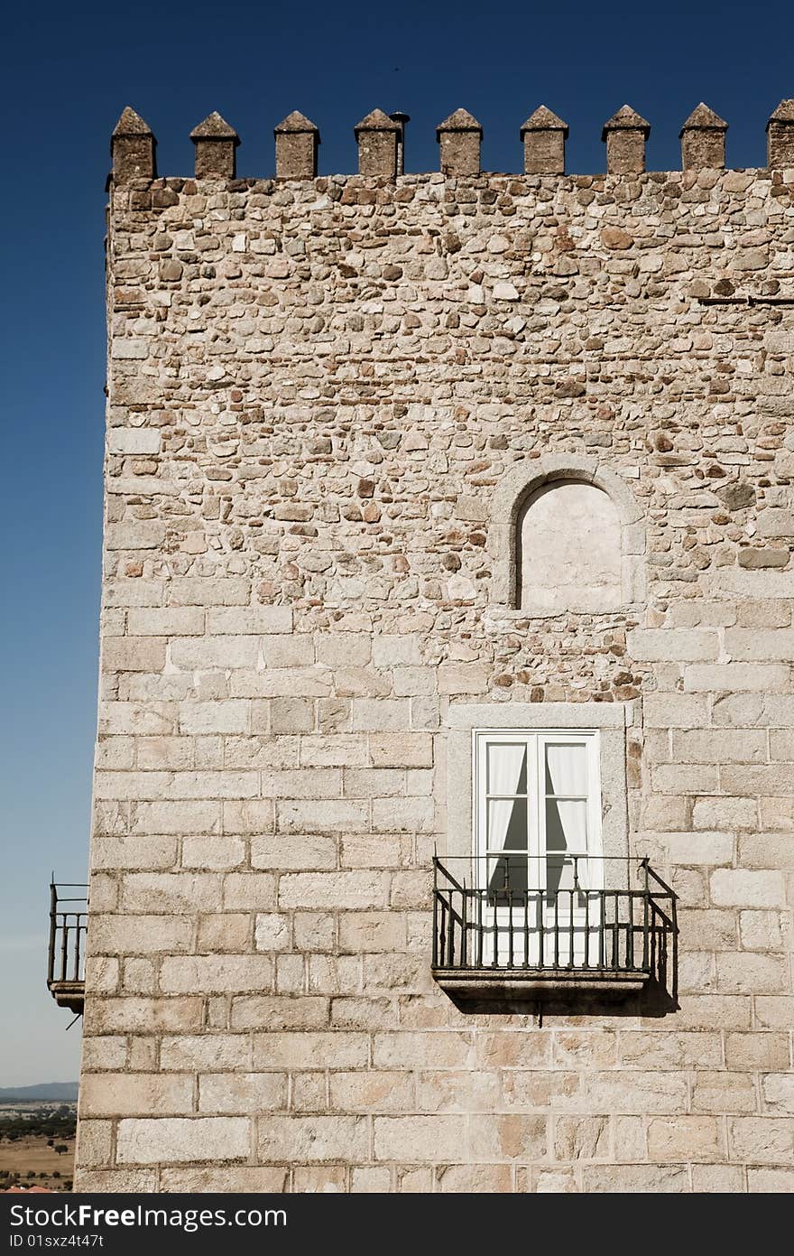 Medieval stone tower under Andalusian blue sky. Medieval stone tower under Andalusian blue sky.