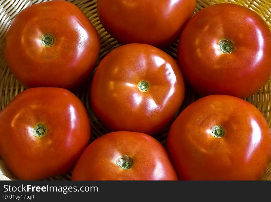 A close up of beef tomatoes in a flower pattern. A close up of beef tomatoes in a flower pattern