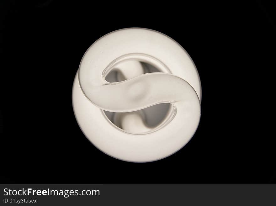 Fluorescent light bulb on black background