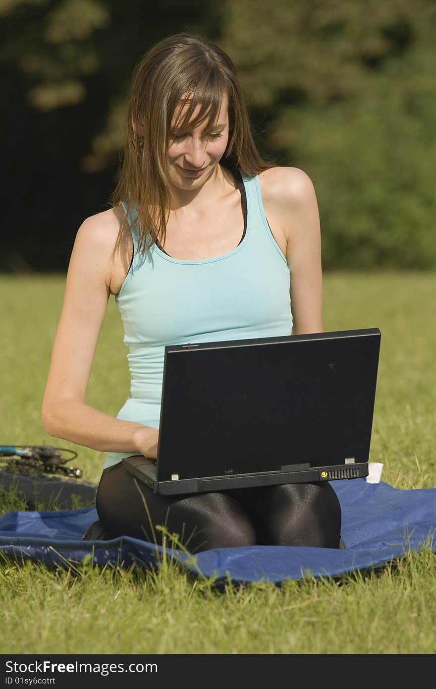 Woman with laptop outdoor