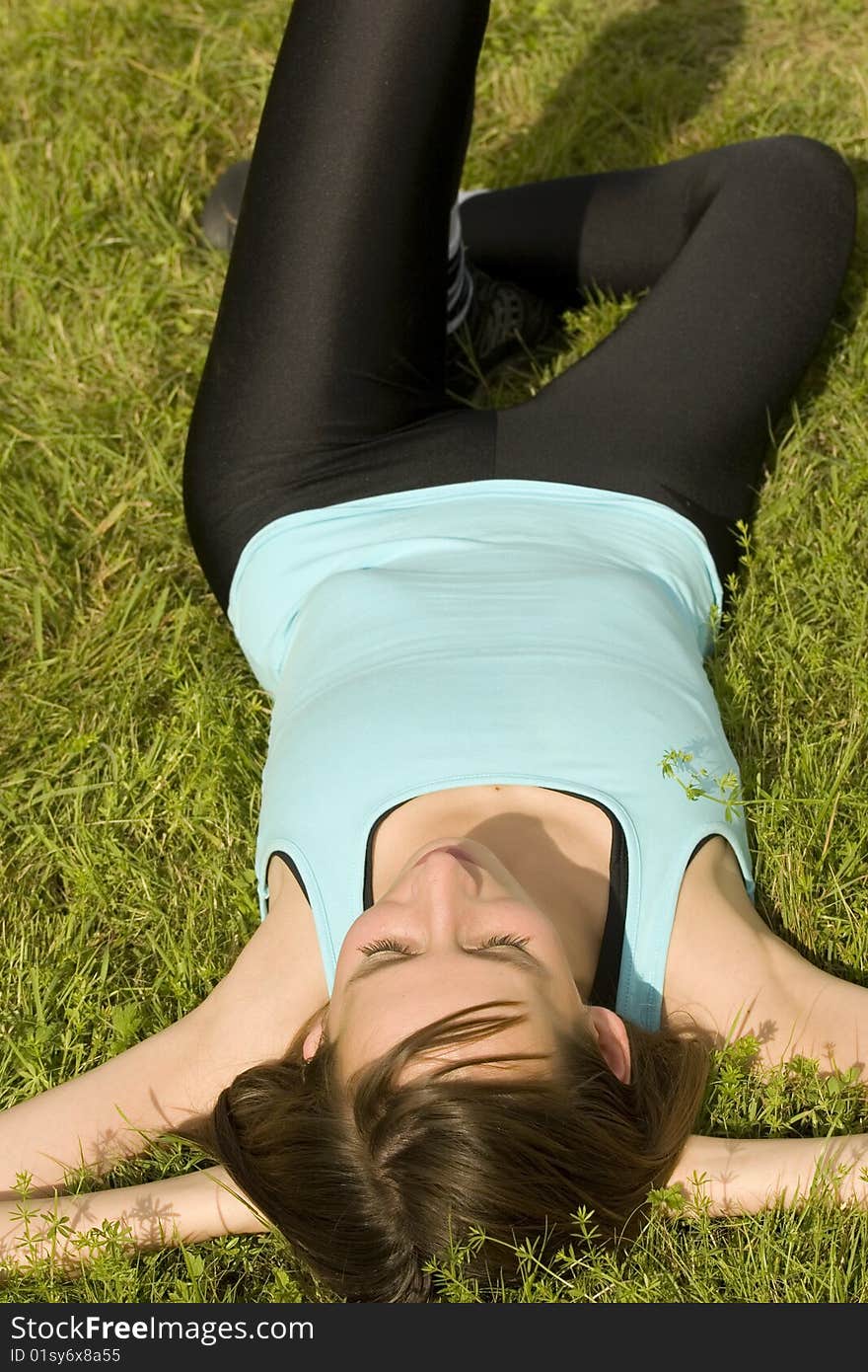 Woman relaxing on grass