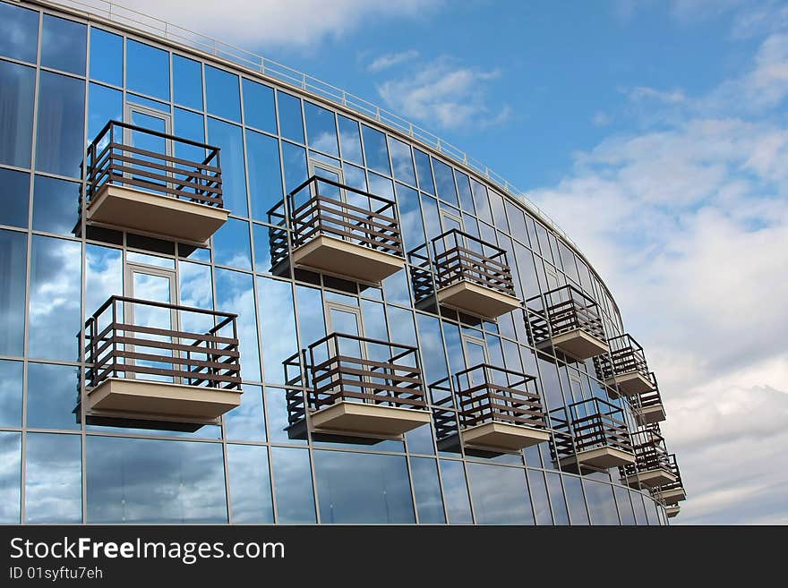 Fragment of a glass wall of small suburban modern hotel