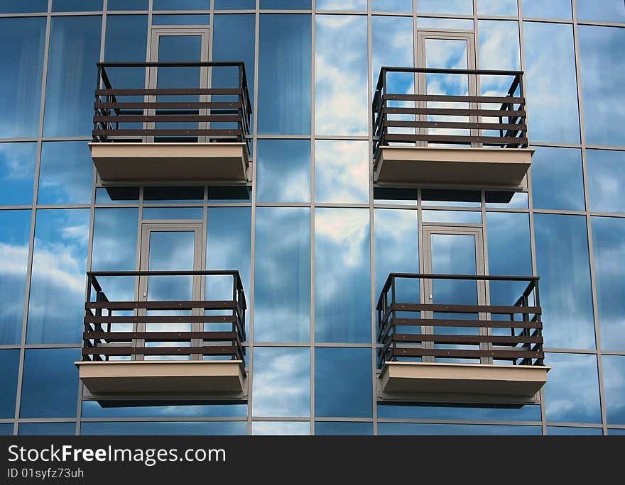 Fragment of a glass wall of small suburban modern hotel. Fragment of a glass wall of small suburban modern hotel