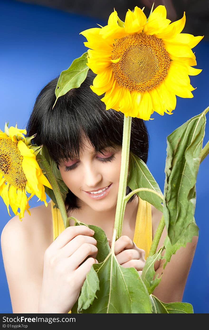 Portrait Of A Beautiful Girl With Sunflowers