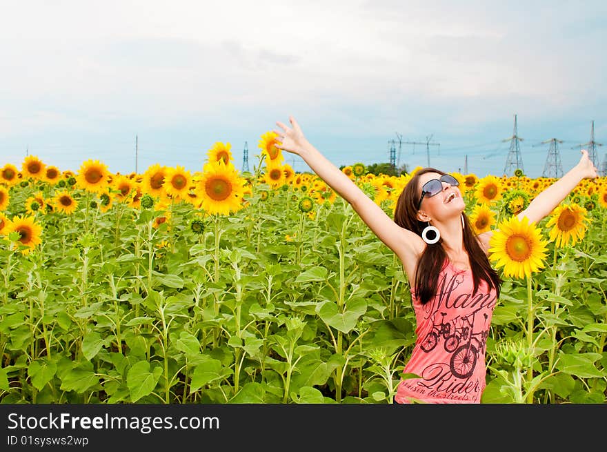 Woman having fun in the field full of sunflowers. Woman having fun in the field full of sunflowers